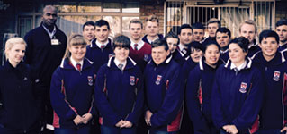 Committee members Marita van den Bergh and John Phala (left) with the Oosterland Grade 12 pupils who attended the presentation.
